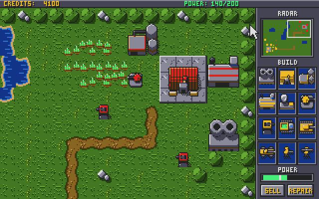 The enemy base in red: barracks on a concrete pad, a war factory, a refinery, a power plant and guard towers
